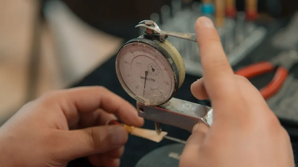 Dial and micrometer checks on the line.