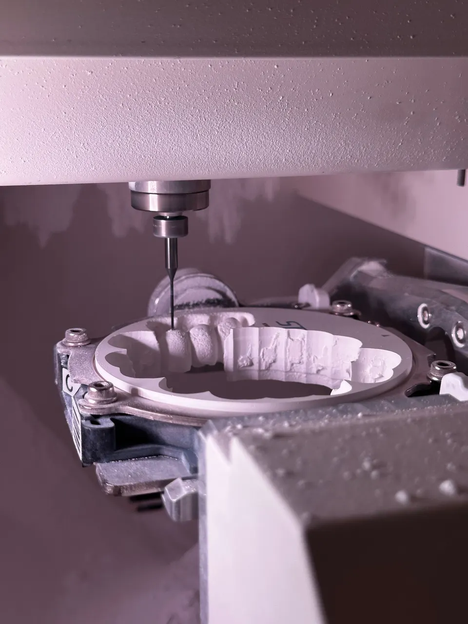 CNC grinding machine finishing a part