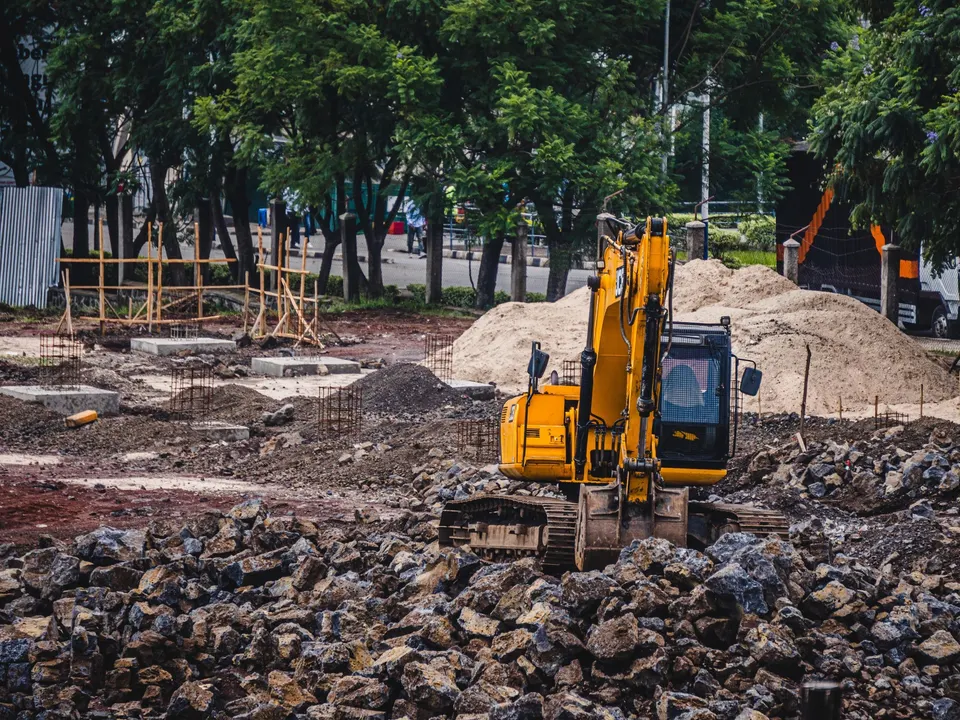 Yellow excavator working at a construction site