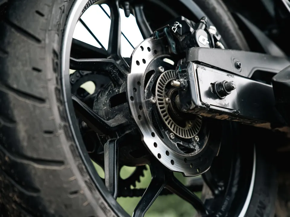 Close-up of a motorcycle rear wheel and disc brake